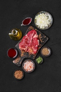 Preparation of Porterhouse steak in wine sauce