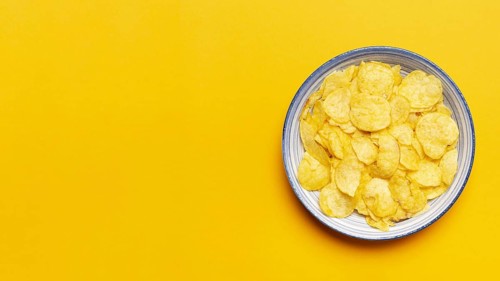 Top view chips bowl yellow background. Resolution and high quality beautiful photo