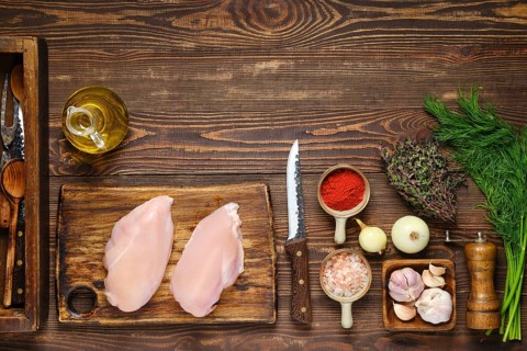 Culinary concept. Overhead view of kitchen table with chicken fillet