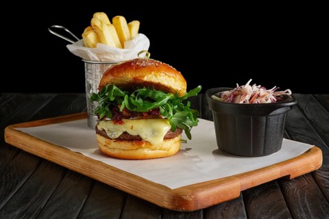 Juicy beef burger with lingonberry sauce