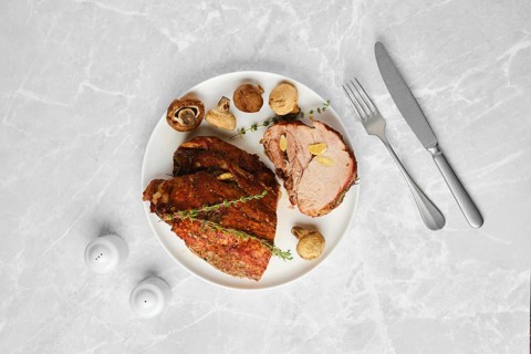 Overhead composition of roasted spicy pork neck