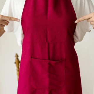 Midsection view woman pointing finger red apron