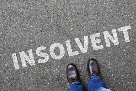 Insolvent symbolic image insolvency bankruptcy debt finance and economy money crisis as business concept with businessman in Stuttgart