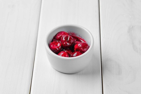 Cherry sauce in ceramic gravy boat