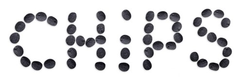 Inscription potato chips made of black chips isolated on white