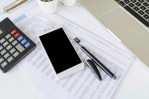 Desk office accountant with calculator smartphone