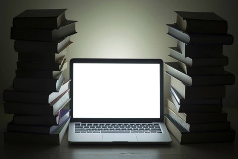 Laptop dark stacked books. Resolution and high quality beautiful photo