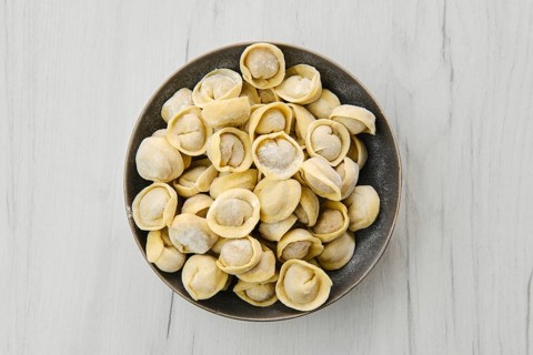 Top view of homemede meat dumplings on white wooden table