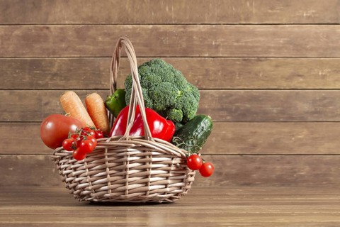 Wooden background with basket full vegetables. Resolution and high quality beautiful photo