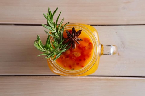 Cup of sea buckthorn tea with citrus