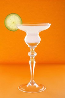 Gin tonic cocktail on orange background