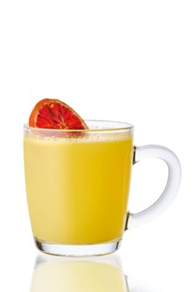 Transparent cup with handle with hot citrus drink isolated on white background