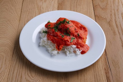 Meatballs with rice on wooden table on wooden table