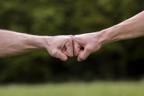 Fist bump welcome gesture