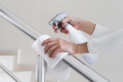 Hands disinfecting hand rail