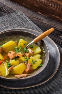 Red salmon fish soup with potato and carrot