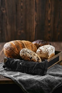 Assortment of artisan bread in wooden box