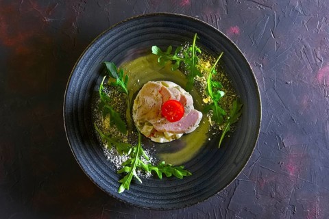Olivier salad with slices of turkey