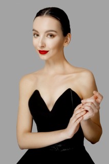 Pretty young fashion model with tan skin and red mat lips. Beauty shoot