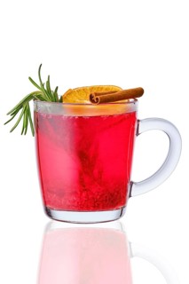 Glass of hot cranberry drink isolated on white background