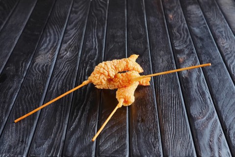 Appetizer for reception. Deep-fried shrimp on skewer