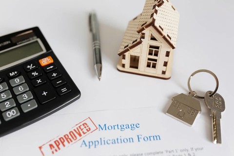 Mortgage contract house figurine