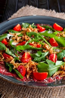Beef carpaccio with tomato cherry