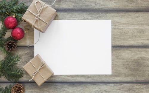 Paper near present boxes and fir branch