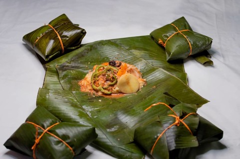 Top View of raw ingredients of the Nicaraguan nacatamal on banana leaves. Raw ingredients for the preparation of the traditional Nacatamal
