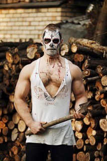 Male daemon with axe near firewood placing. Face painting art