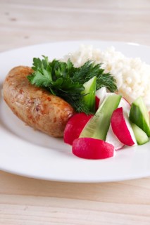 Fried sausage with rice and fresh cucumber and radish