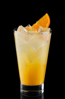 Cold fizz cocktail with orange isolated on black background