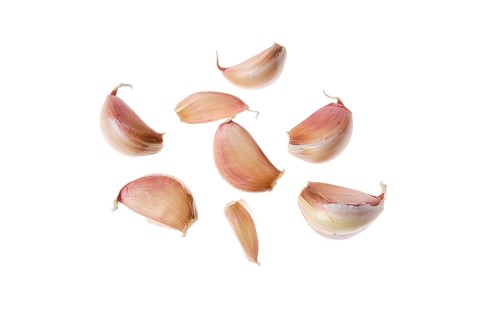 Cloves of garlic isolated on white