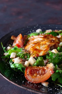 Fried turkey fillet with arugula