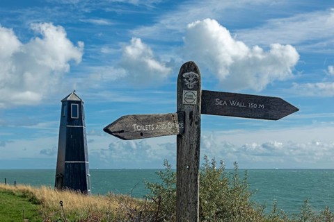 Tower and signpost