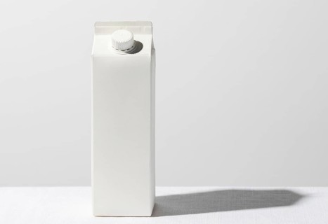 Front view milk carton with copy space