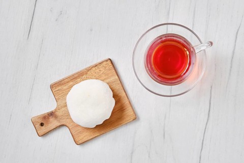 Top view of sweet dessert mochi with coconut chips with fruit tea