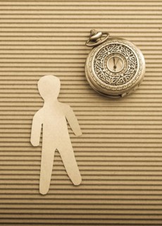 Paper man shape and a retro pocket watch