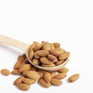 High angle almonds spoon with copy space