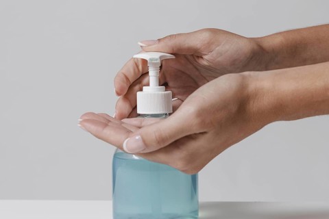 Using gel hydroalcoolique hand sanitizer from bottle. Resolution and high quality beautiful photo