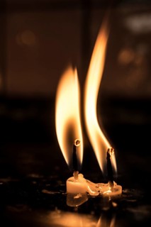 Burning candle making light in view