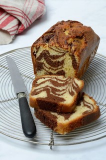 Marble cake and knife on cake rack