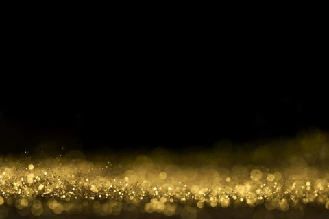 Close up golden glitter with copy space