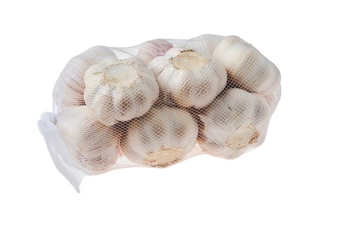 Pouch with garlic bulbs isolated on white
