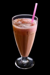 Cappuccino milkshake isolated on black background