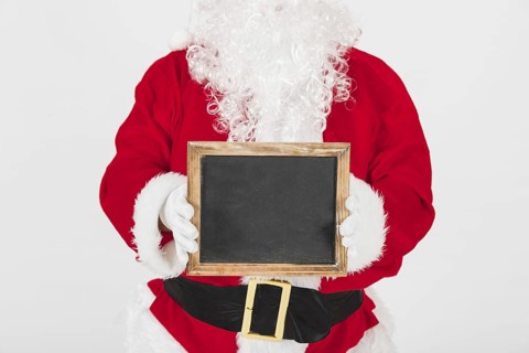 Santa claus showing empty wooden frame. Resolution and high quality beautiful photo