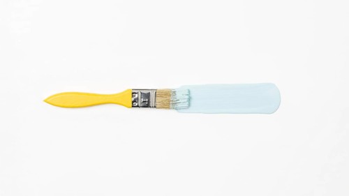 Top view yellow brush with blue paint. Resolution and high quality beautiful photo