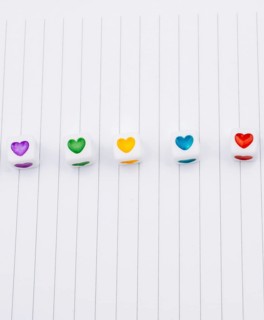 Love cubes and paper arrow on a notebook