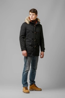 Full length portrait of handsome man in warm coat with hood posing in studio