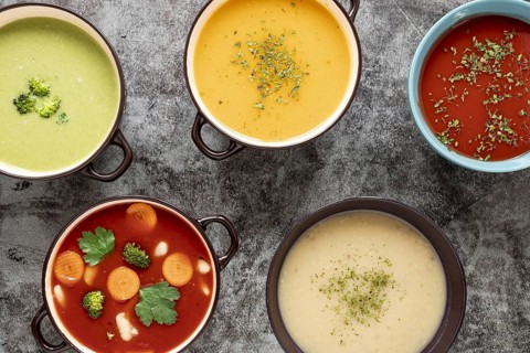 Flat lay homemade soups assortment